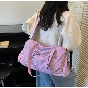 Large capacity purple sports duffel bag for women, lightweight waterproof fitness gym travel bag.