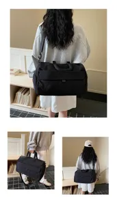 Detailed view of the large black travel duffel bag carried by model, showing its size and strap.