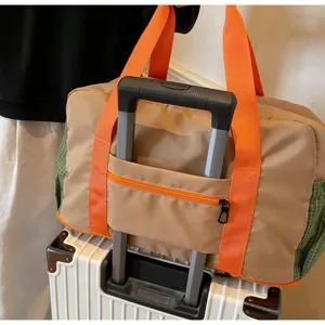 Large capacity travel duffel bag with luggage sleeve lightweight waterproof gym sports tote bag.
