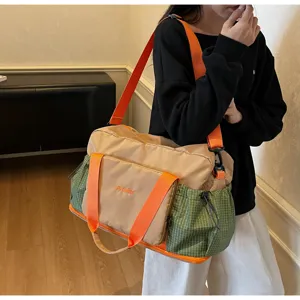 Large capacity travel duffel bag for women, lightweight fitness gym bag with wet dry separation.