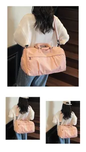 Stylish large capacity pink travel duffel bag with shoulder strap for fitness and sports.