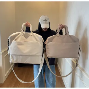 Large capacity travel duffel bag with shoulder strap, perfect for short trips and gym fitness.
