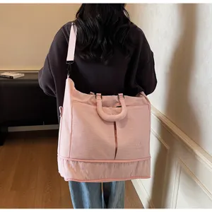 Large capacity pink travel bag, waterproof gym duffel bag with trolley sleeve and shoulder strap.