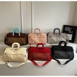 Large capacity travel duffel bag with shoulder strap, stylish gym sport bag for women.