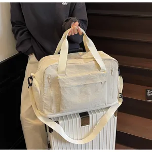 Large capacity travel duffle bag with multiple pockets for sports, gym, and weekend trips.