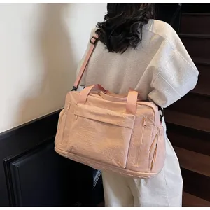 Large capacity pink travel duffel bag for women, portable sports fitness gym bag for short trips.