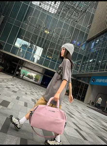 Large capacity pink travel duffel bag for women and men, perfect for gym sports and weekend trips.