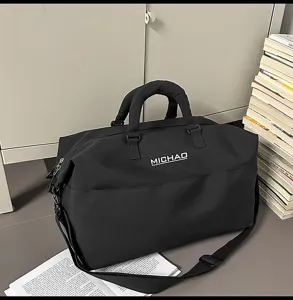 Large capacity black travel duffel bag for women and men, lightweight gym and weekend bag.