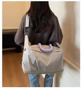 Lightweight large capacity travel duffel bag for women, perfect for gym, sports and trips.