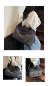 Large capacity travel duffel bag for women, lightweight nylon and plaid weekend gym luggage.