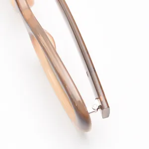 Close-up detail of trendy brown polarized sunglasses frame hinge, premium minimalist eyewear design.