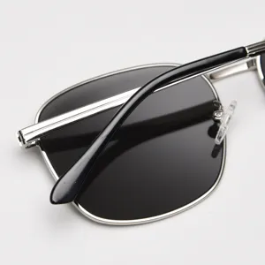 Detailed view of trendy metal square frame sunglasses with black lenses and sleek arms.