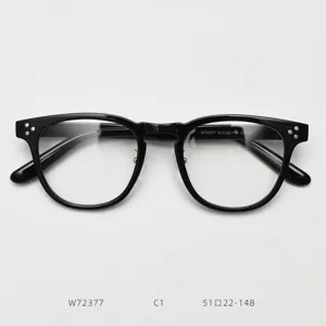 Detailed view of classic black optical glasses frame with retro design and clear lenses.