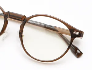 Close-up detail of vintage brown optical glasses frame, lightweight temple and hinge.