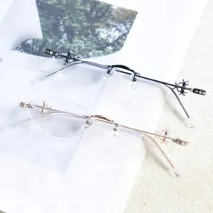 Detailed shot of stylish rimless oval eyeglasses frame with sparkling rhinestones and decor.