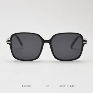 Detailed view of black square fashion sunglasses, highlighting the metal temples and sturdy frame.