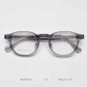 Detailed view of retro thick acetate optical glasses frame, clear lens, unisex fashion style.