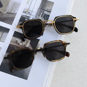 Retro square metal polarized sunglasses detail view, stylish dual-tone sunglasses close up.