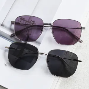 Polygon metal sunglasses with purple and black lenses, trendy vintage eyewear for street snap.