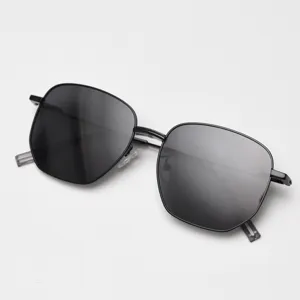 Vintage polygonal metal polarized sunglasses for men and women, stylish black frame sun eyewear.