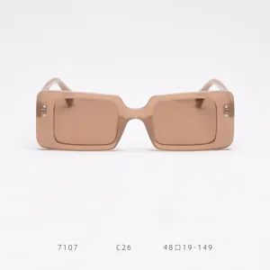 Detail view of light brown square TR polarized sunglasses featuring metal rivets and gradient lenses.