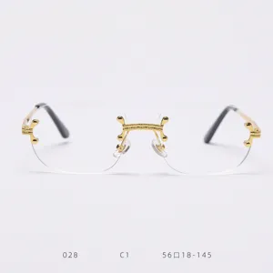 Detailed view of vintage rimless glasses with exquisite gold bridge and sleek metal temples.
