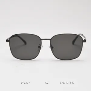 Detail view of retro metal square sunglasses featuring dark grey lenses and slim frame.