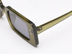 Detail view of trendy retro square polarized sunglasses in olive green, stylish eyewear.