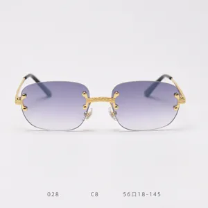 Detailed view of vintage rimless sunglasses with purple gradient lenses and gold metal details.