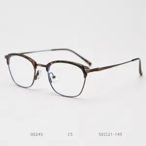 Vintage metal half-rim prescription glasses frame for men and women, stylish optical eyewear.