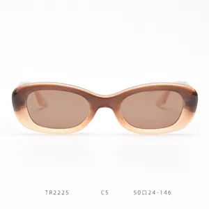Close-up of TR90 small frame brown gradient sunglasses detail, trendy street style eyewear.