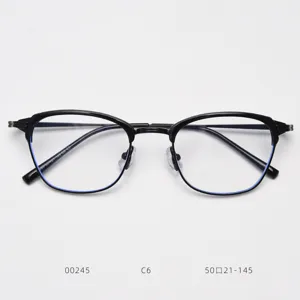 Detailed view of black metal half-frame vintage style eyeglasses frame with clear lenses.