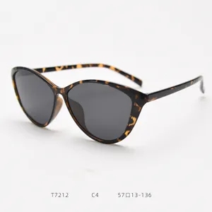 Detailed view of vintage cat-eye sunglasses with tortoiseshell frame and dark lenses.
