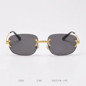 Vintage rimless sunglasses for women and men, luxury gold metal frame with dark lenses.
