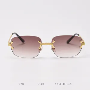 Retro rimless gradient sunglasses with metallic gold C-bridge and detailed luxury temple design.