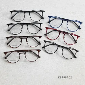 Detailed view of multiple colors retro round eyeglass frames, clear lenses, stylish design.