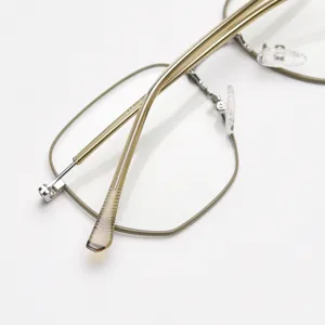 Montatura per occhiali in metallo dorato, montatura ottica poligonale leggera stile.