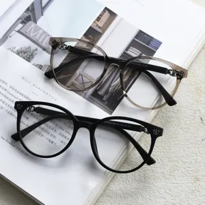 Stylish round prescription glasses frames for women and men, classic black and grey gradient design.