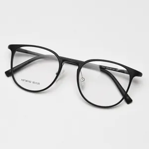 Detail view of black round optical glasses frame, classic retro style spectacle detail shot.