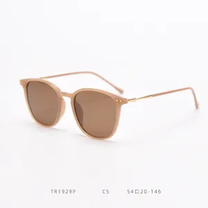 Detail view of stylish square polarized sunglasses with light frame and metal rivet accents.