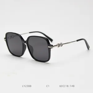 Fashion oversized polarized sunglasses for women, retro black frame with metal temples.
