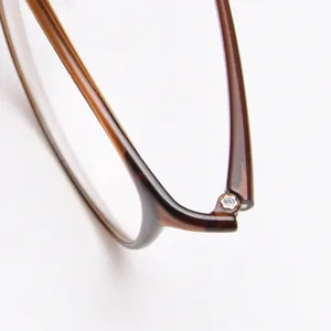 Brown tortoise shell glasses frame detail, lightweight plastic steel optical eyewear close up