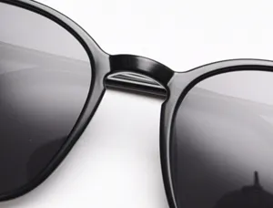 Close-up detail of black square polarized sunglasses frame, sleek bridge design for daily wear.