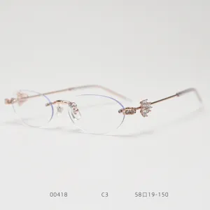 Close up detail of women's fashion rimless oval optical frame with delicate rhinestones.
