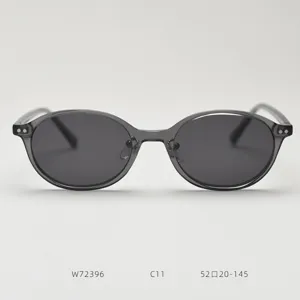 Detail view of grey oval TR90 polarized sunglasses, showcasing clean frame and dark lenses.