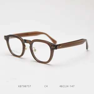 Detailed view of vintage thick acetate optical glasses frame in brown with clear lenses.