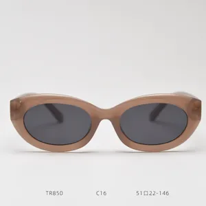 Retro oval cat-eye sunglasses featuring translucent light brown TR90 frame and dark grey polarized lenses.