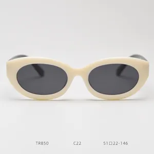 Retro TR90 small oval cat-eye sunglasses with thick beige frame and dark polarized lenses.
