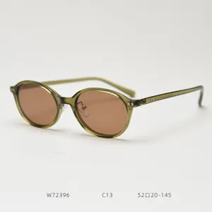 Retro oval TR90 polarized sunglasses for men and women, stylish green frame and brown lens.