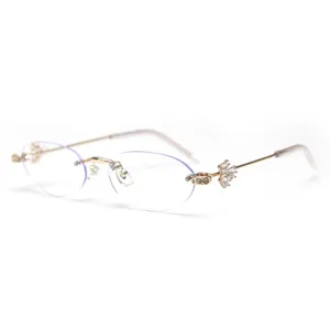 Chic rimless oval glasses frame for women with sparkling rhinestones and gold temples.